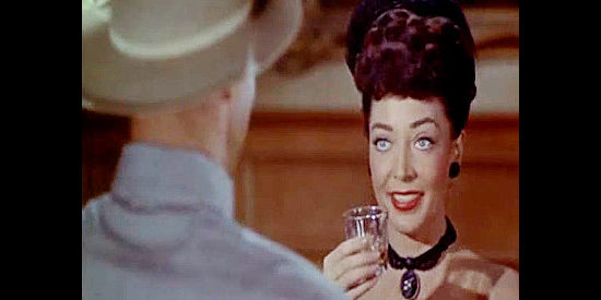 Marie Windsor as Alice Williams, introducing herself to the handsome stranger who's arrived in town in The Bounty Hunter (1954)