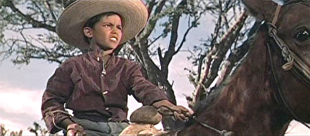 Mario Navarro as Panchito, riding off to search for his father in The Beast of Hollow Mountain (1956)
