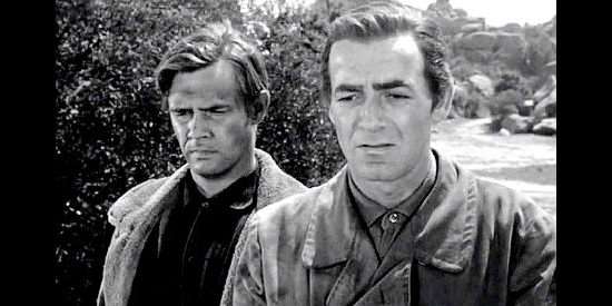 Mark Stevens as Lucas, mourning the loss of his parents with Simon (John Lupton), his best friend in Gun Fever (1958)