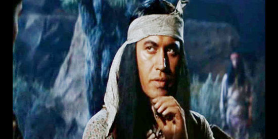 Michael Ansara as Delgadito, listening to Gato's pleas to kill his travelling companions in Quantez (1957)