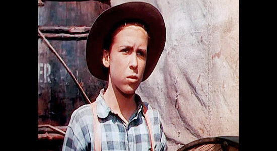 Michael Chapin as Ben Wilkins, the young runaway Jeff Curtis returns to his father and sister in Wagons West (1952)