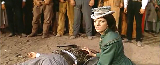 Monique St. Claire as Maude Clevenger with her dead husband in Adios Gringo (1965)
