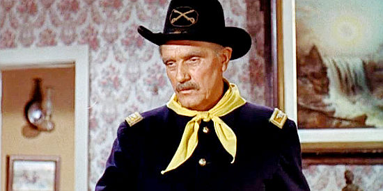 Morris Ankrum as Col. Conover, explaining the danger of traveling into Indian territory to Maylene Mason in Quincannon, Frontier Scout (1956)