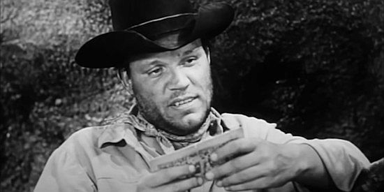 Neville Brand as Harry Sutton, suspecting an undercover agent has infiltrated the gang in The Return of Jack Slade (1958)