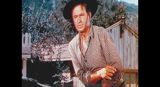 Noah Beery Jr. as Arch Lawrence, about to buy passage on the wagon train for he and his wife in Wagons West (1952)