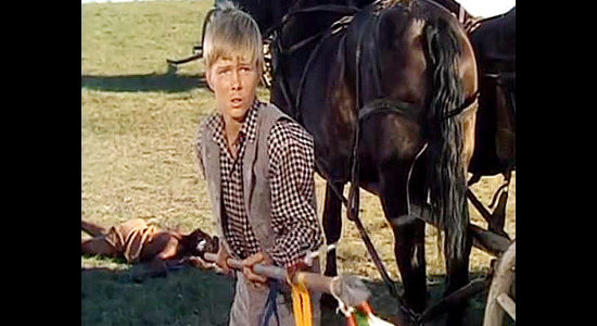 Orley Lindgren as young Jim Aherne, prepared to defend himself with a Crow lance if necessary in The Savage (1952)