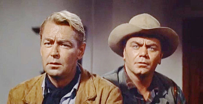 Alan Ladd as Peter Van Hoek, aka The Dutchman, and Ernest Borgnine as John McBain in The Badlanders (1958)