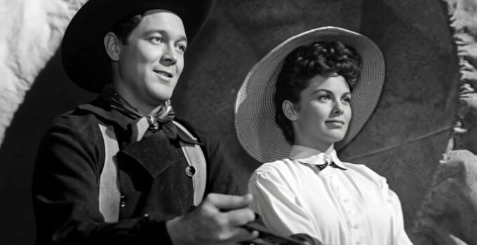 Ben Johnson as Travis Blue and Joanne Dru as Denver, traveling West in Wagon Master (1950)