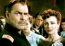 Brian Donlevy as Capt. Dempster and Virginia Grey as Lorabelle Larkin react when a young girl is taken captive by an outlaw in Slaughter Trail (1951).