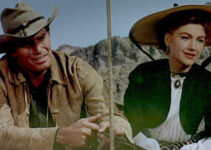 Charlton Heston as Colt Saunders, taking Lorna (Anne Baxter) home to the Bar S ranch in Three Violent People (1957)
