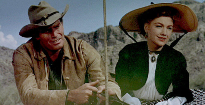 Charlton Heston as Colt Saunders, taking Lorna (Anne Baxter) home to the Bar S ranch in Three Violent People (1957)