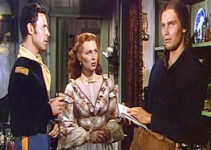 Charlton Heston (right) as Jim Aherne, remembering back to his upbringing with Lt. Hathersall (Peter Hansen) and his sister Talley (Susan Morrow) in The Savage (1952)