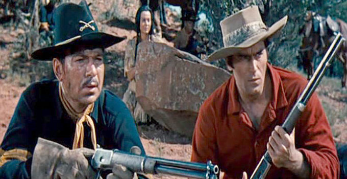 Claude Akin as the sergeant and Clint Walker as Yellowstone Kelly await the next Sioux attack in Yellowstone Kelly (1959)
