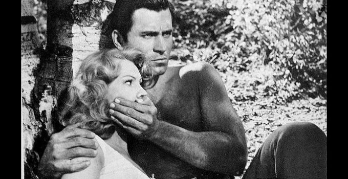 Clint Walker as Gar Davis, trying to keep Celia Gray (Virginia Mayo) silent with an Indian war party nearby in Fort Dobbs (1958)