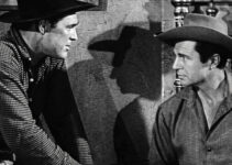 Don Megowan as Cheney Hollnad, turning the tables by handcuffing Marshal Matt Gordon (Jim Davis) in A Lust to Kill (1958)