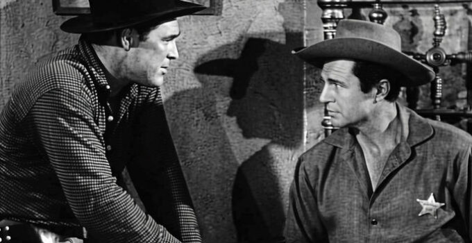 Don Megowan as Cheney Hollnad, turning the tables by handcuffing Marshal Matt Gordon (Jim Davis) in A Lust to Kill (1958)