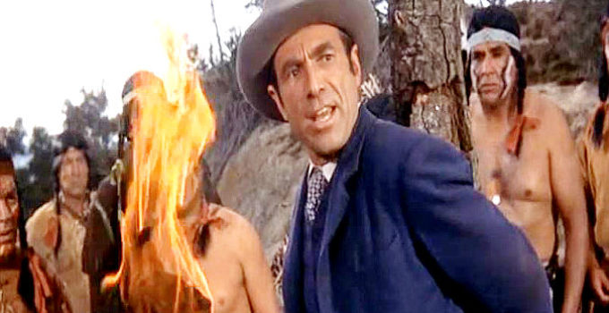 Gary Merrill as Brock Marsh, trying to talk his way out of being burned at the stake in The Black Dakotas (1954)