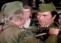 George Montgomery as Capt. Jed Horn, being restrained by a friend in Fort Ti (1953)