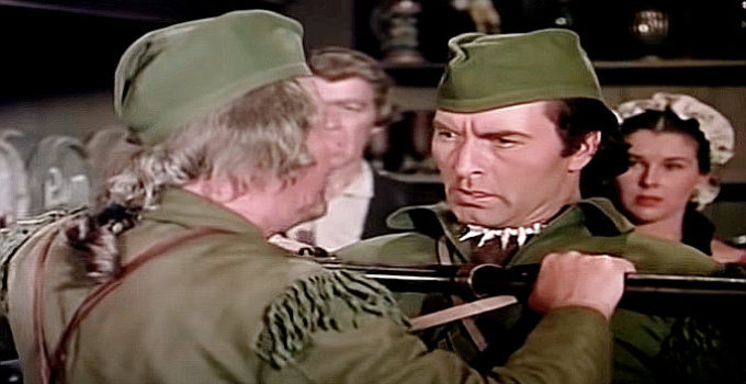 George Montgomery as Capt. Jed Horn, being restrained by a friend in Fort Ti (1953)