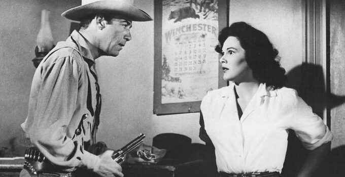 Gerald Mohr as Slinger and Patricia Medina as Angela in The Buckskin Lady (1957)