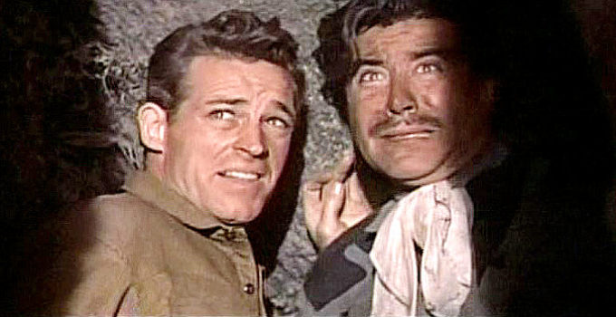 Guy Madison as Jimmy Ryan and Eduardo Noriega as Enrique Rios in The Beast of Hollow Mountain (1956)