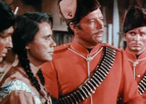 James Craig as Mountie Dick Ross, investigating a case of stolen furs with younger brother Carey (Keith Larsen, right) in Fort Vengeance (1953)