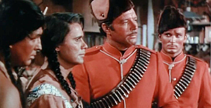 James Craig as Mountie Dick Ross, investigating a case of stolen furs with younger brother Carey (Keith Larsen, right) in Fort Vengeance (1953)