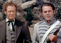 James Seay as Gov. Harrison and Jon Hall as Steve Ruddell, trying to keep the U.S. out of a war with the British in Brave Warrior (1952)