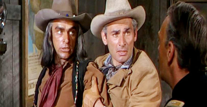 Jeff Chandler (middle) as Maj. Howell Brady, trying to calm Seminole leader Maygro (Henry Brandon) after the Army has broken a promise in War Arrow (1953)