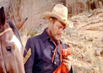 Joel McCrea as Sgt. Vinson, mourning the loss of another member of his patrol in Fort Massacre (1958)