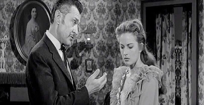 Kent Taylor as Duke Chadwick and Colleen Gray as Sylvia Melbourne, in a disagreement over the man she intends to marry in Frontier Gambler (1956)