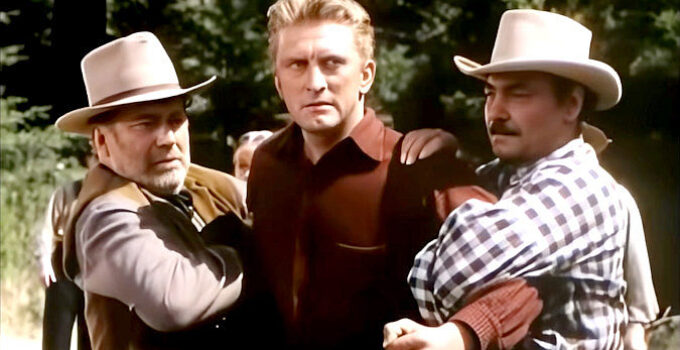 Kirk Douglas as JIm Fallon, in trouble after one of his falling trees claims a life in The Big Trees (1952)