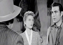 Peggy Castle as Paula Collins and Stephen McNally as Vic Rodell in Hell's Crossroads (1957)