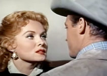 Rhonda Fleming as Cheyenne O'Mally and new husband Guy Madison as Steve Daley in Bullwhip (1958)