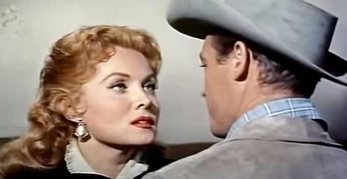 Rhonda Fleming as Cheyenne O'Mally and new husband Guy Madison as Steve Daley in Bullwhip (1958)