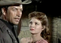 Richard Egan as Wes Tancred, fending off the advances of Cathy Older (Angie Dickinson) in Tension at Table Rock (1956)