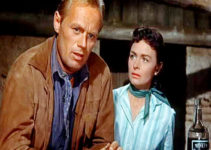 Richard Widmark as Jim Slater and Donna Reed as Karyl Orton in Backlash (1956)