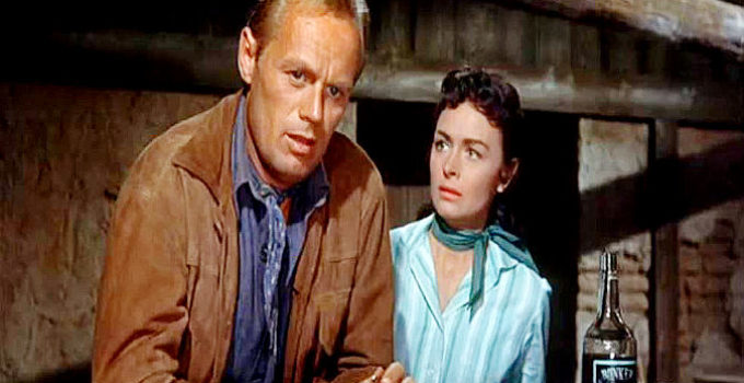 Richard Widmark as Jim Slater and Donna Reed as Karyl Orton in Backlash (1956)