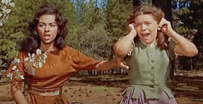 Rita Moreno as Hetty and Cathy O'Donnell as Judith, spotting their father on a stake surrounded by fire in The Deerslayer (1957)