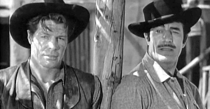 Robert Horton as Tom Herrera and Gilbert Roland as Peso, in a stage station under seige in Apache War Smoke (1952)