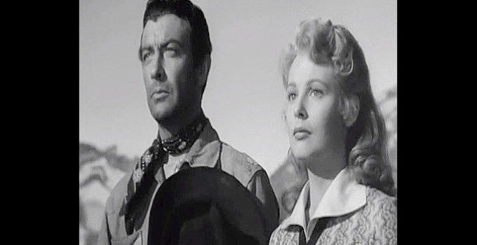 Robert Taylor as Ward Kinsman and Arlene Dahl as Ann Duverall in Ambush (1950)