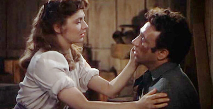 Ruth Roman as Judith Burns, helping Bob Peters (Dane Clark) after he's been beaten in Barricade (1950)