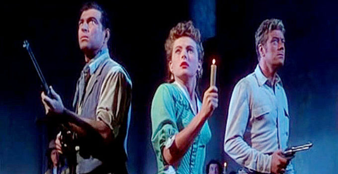 Stephen McNally as Sam Leeds, Coleen Gray as Sally and Willard Parker as Joe Madden, awaiting an Apache attack in Apache Drums (1951)