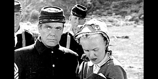 Patrick Sexton as Lt. Bascomb, with his wife and infant as the Indian threat grows in The Yellow Tomahawk (1952)
