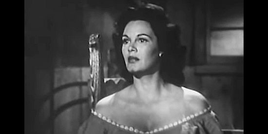 Patricia Medina as Angela Medley, finding herself trapped with a man she doesn't love in The Buckskin Lady (1957)