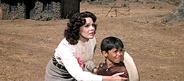 Patricia Medina as Sarita and Mario Navarro as Panchito, catching sight of the approach beast in The Beast of Hollow Mountain (1956)