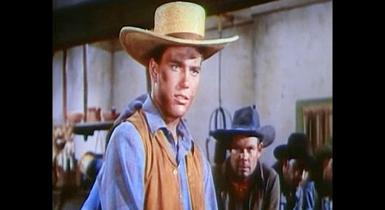 Patrick Wayne as Sheriff Jim Ellison, looking for a deputy to guard his prisoner in The Young Land (1959)