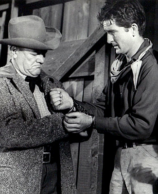 Paul Birch as Matt Crawford with Robert Knapp as Gil Reardon in Gunmen from Laredo (1959)