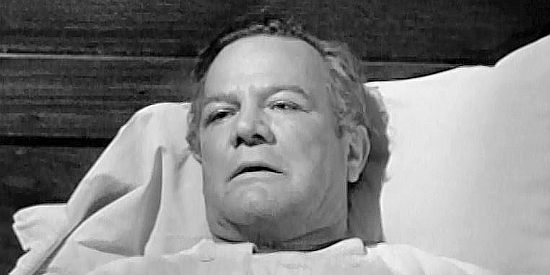 Paul Birch as Thad Arnold, sharing the secret of a half-Indian daughter on his death bed in The White Squaw (1956)