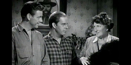 Paul Langton as Violet and Harry Morgan as Cottonwood, presenting mom Annie Goss (Marjorie Main) with a special plumed hat in Gentle Annie (1944)